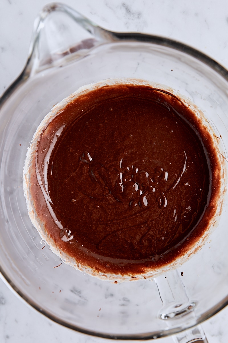 Chocolate batter in glass mixing bowl