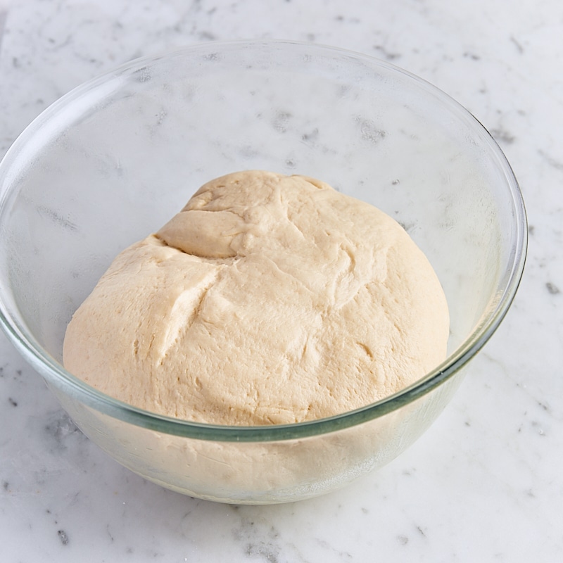 Dough in glass mixing bowl doubled in size after 40 minute rise