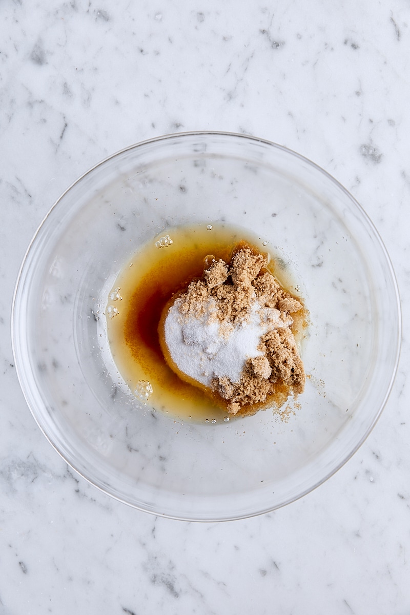 Brown butter, granulated sugar, and light brown sugar in glass bowl