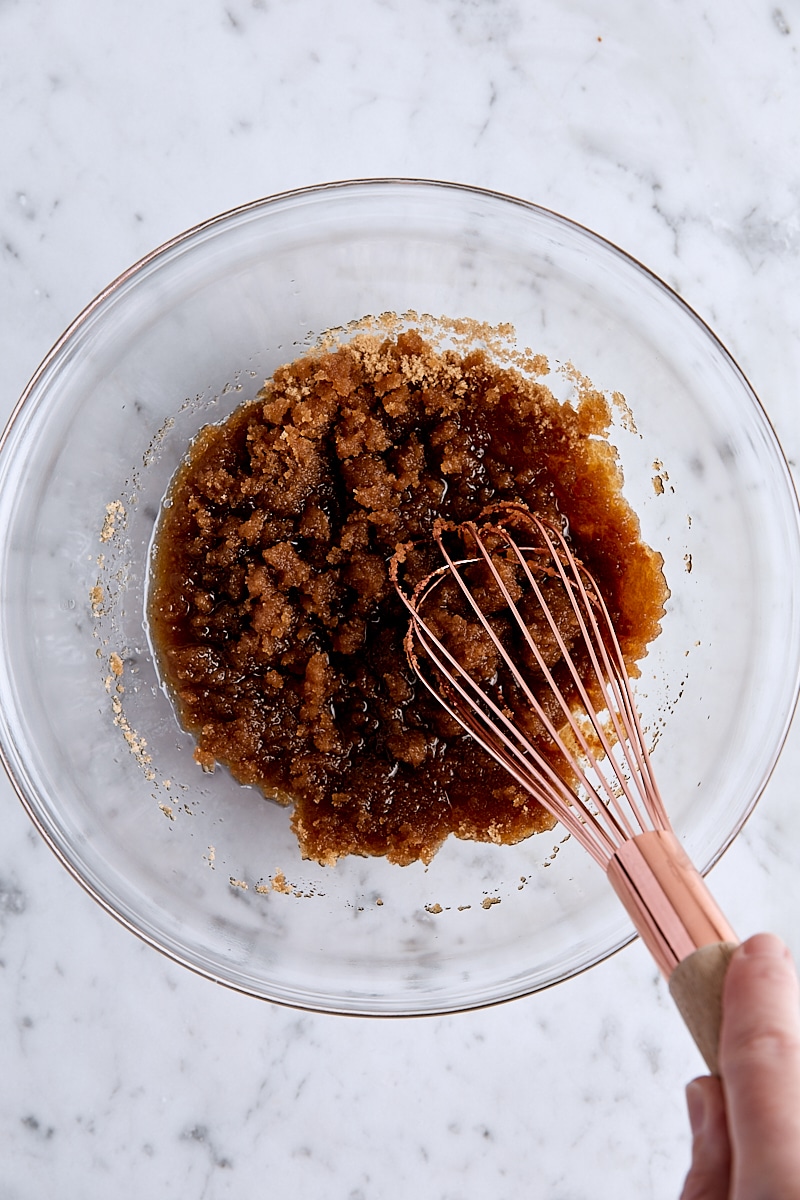 Brown butter and brown sugar whisked together in glass bowl