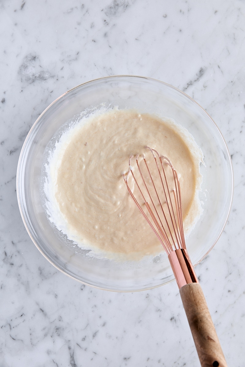 Wet ingredients whisked together in glass bowl