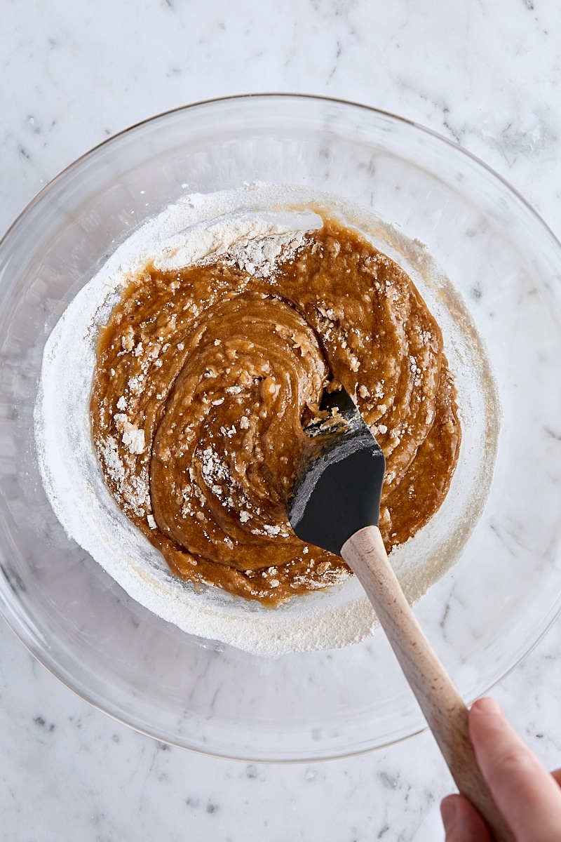 Folding flour into blondie batter with spatula