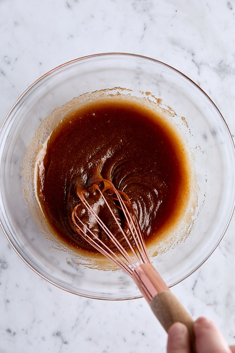 Brown butter, brown sugar, egg, vanilla, almond extract, and salt whisked together in glass bowl