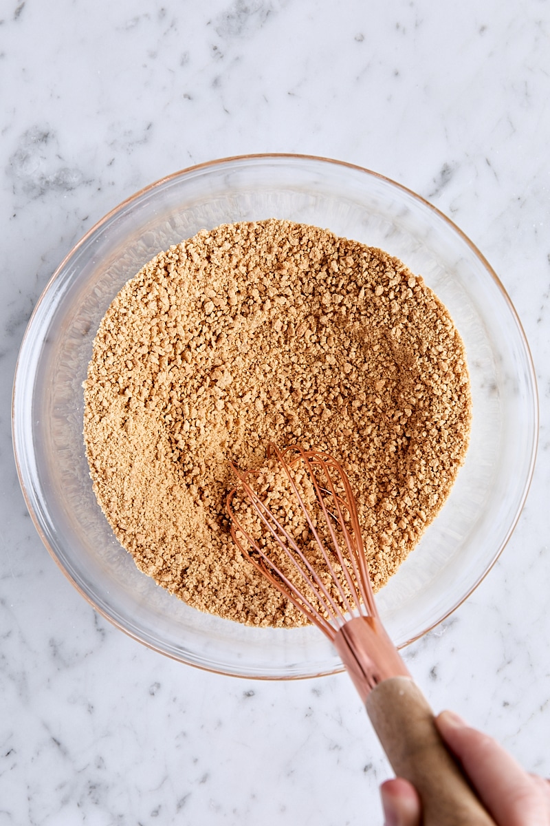 Graham cracker crumbs, granulated sugar, and salt whisked together in glass bowl