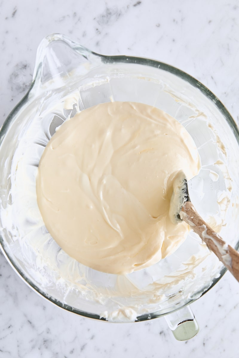 Egg mixed into cheesecake batter