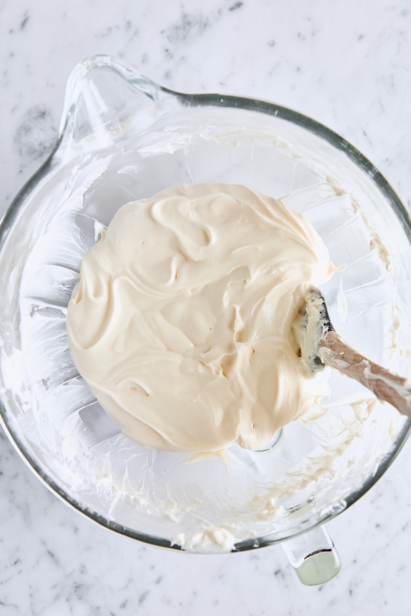 Sour cream and vanilla mixed into cheesecake batter