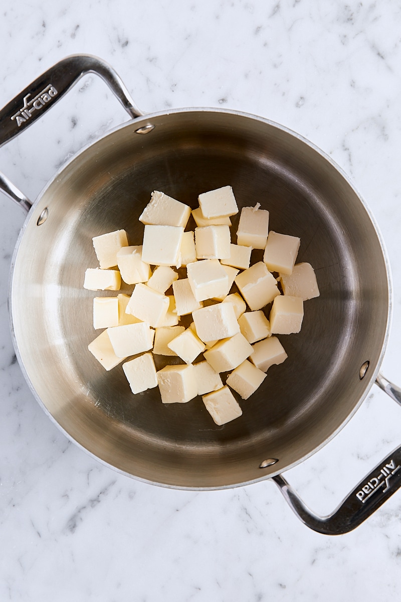 Cubed unsalted butter in saucepan