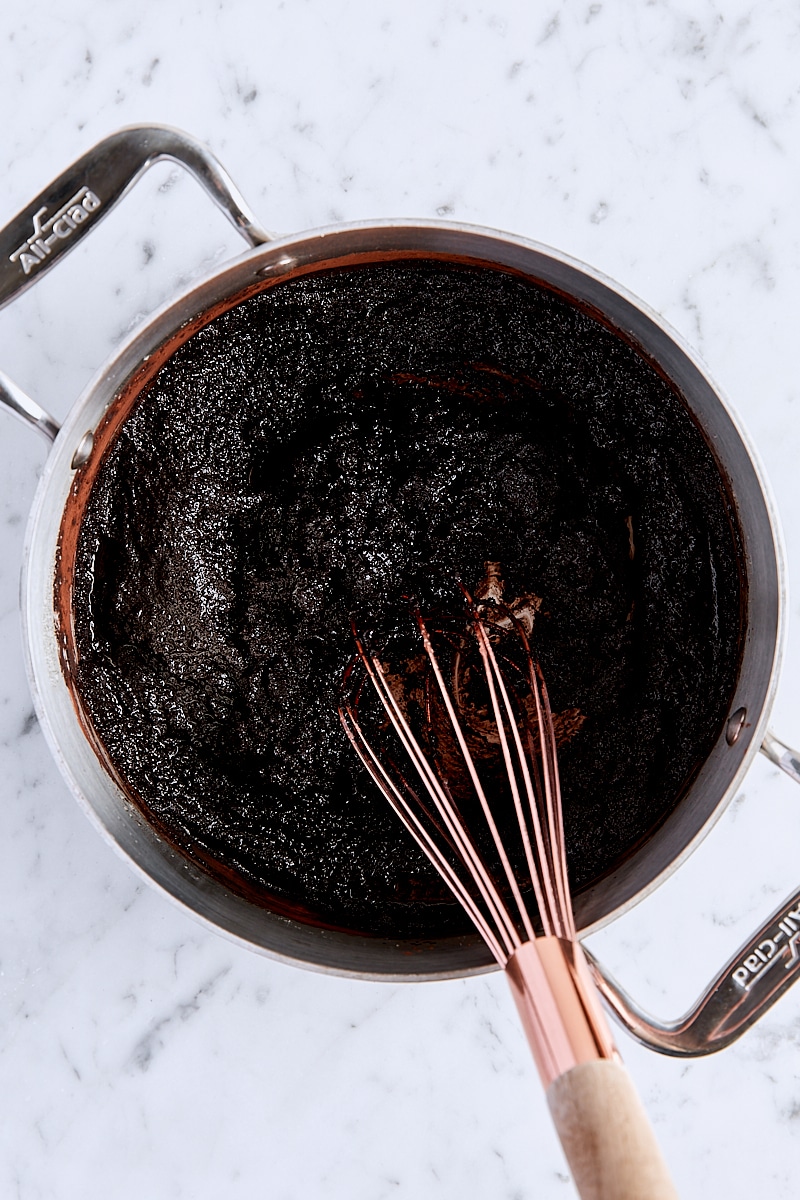 Cocoa powder, espresso powder, and salt whisked into butter-sugar mixture