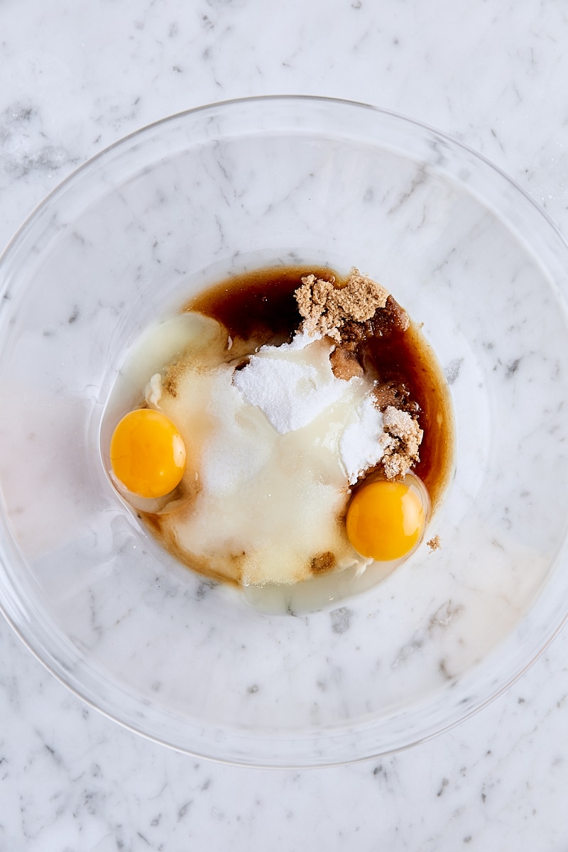 Eggs, sugar, light brown sugar, and vanilla extract in large mixing bowl