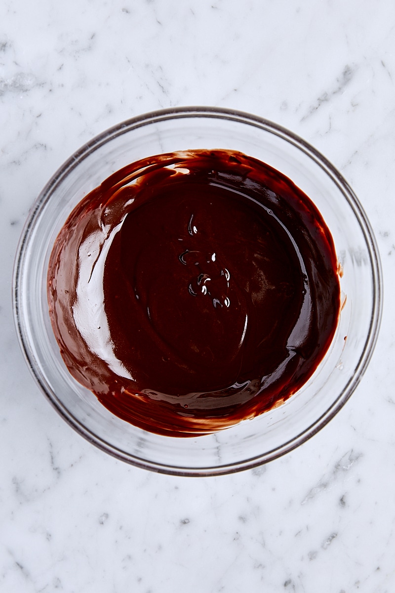 Butter and chocolate melted together in glass bowl