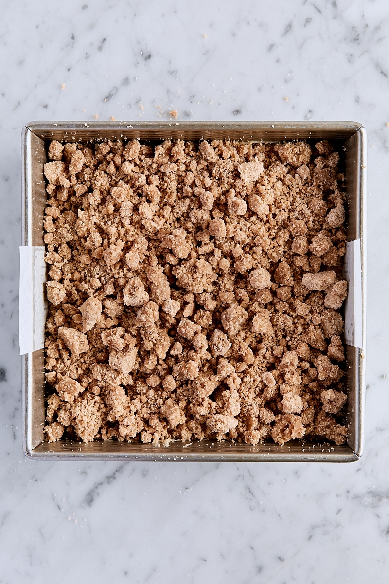 Cake batter topped with crumb topping in pan