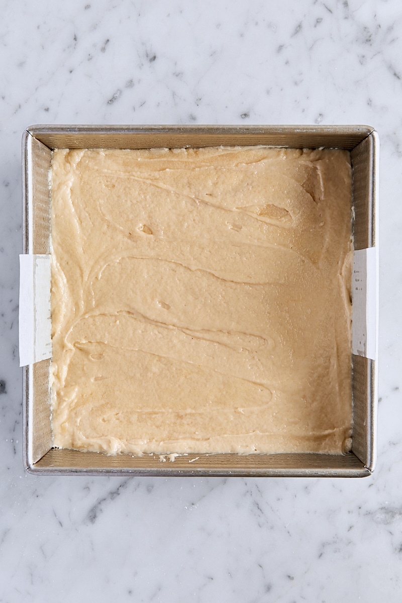 Crumb cake batter spread into 8-inch pan