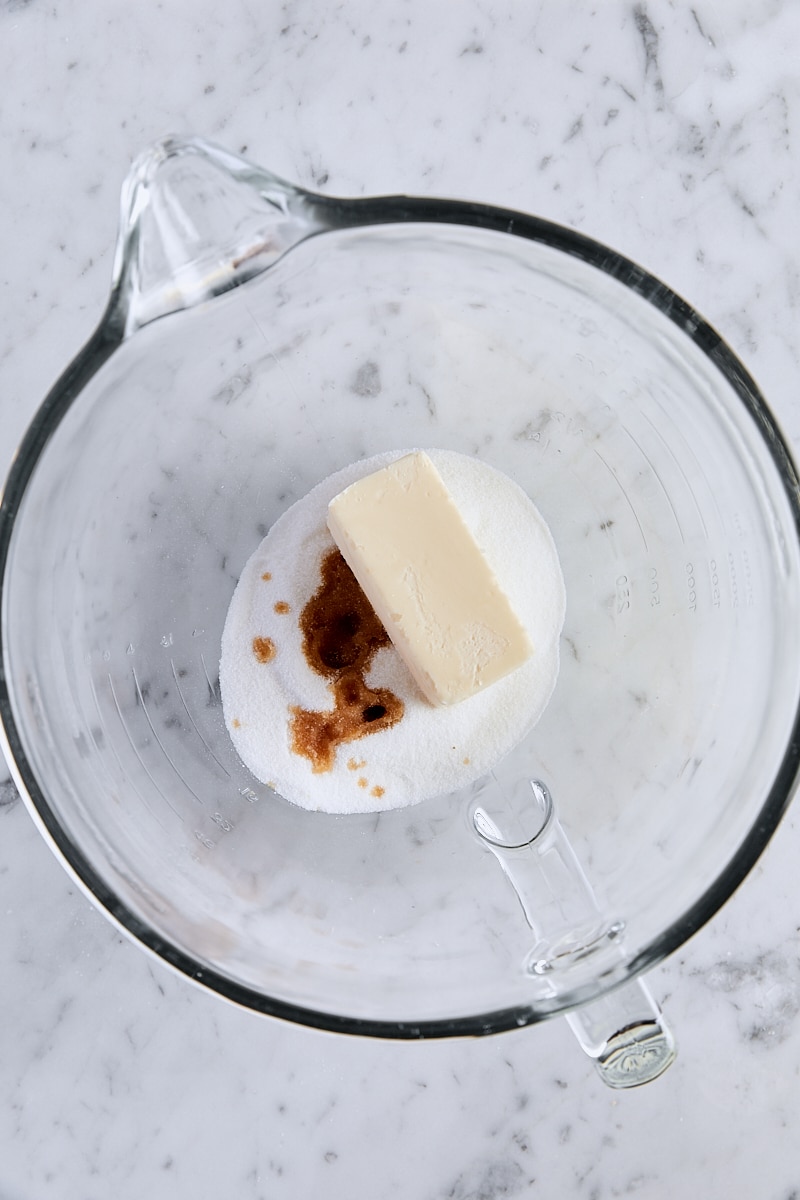 Room temperature butter, granulated sugar, and vanilla in glass mixer bowl
