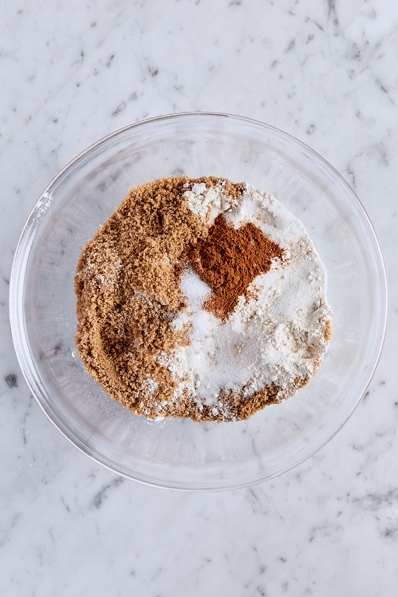 All-purpose flour, dark brown sugar, granulated sugar, cinnamon, and salt in a glass bowl
