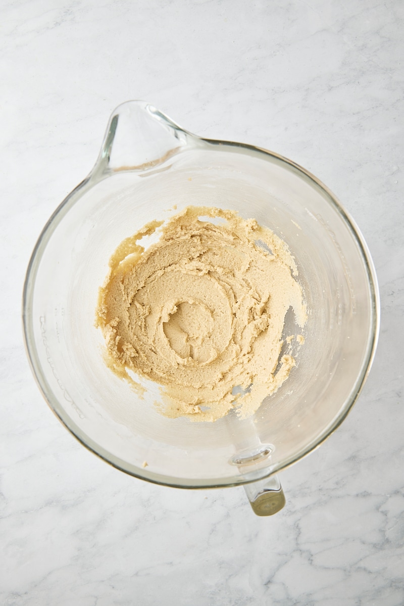 Butter and sugars mixed until soft and creamy in glass mixing bowl
