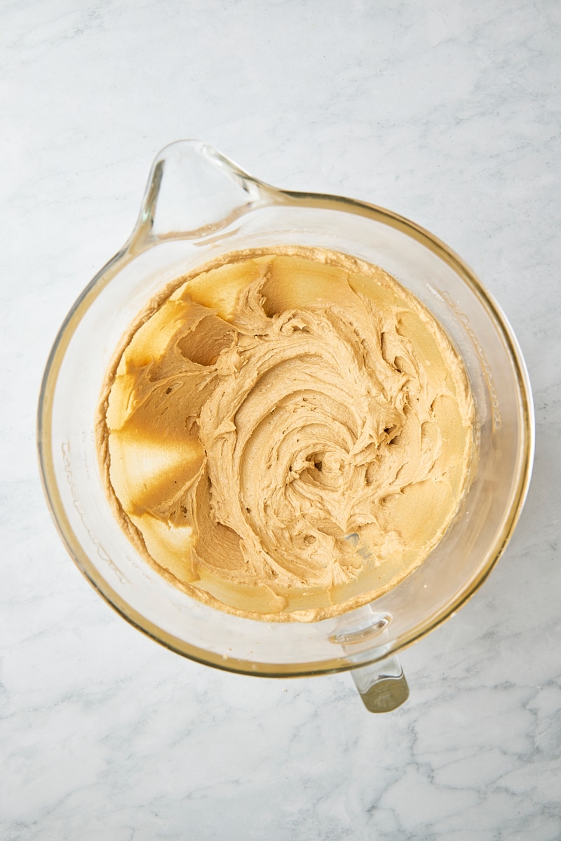 Egg, egg yolk, and vanilla mixed into peanut butter cookie dough