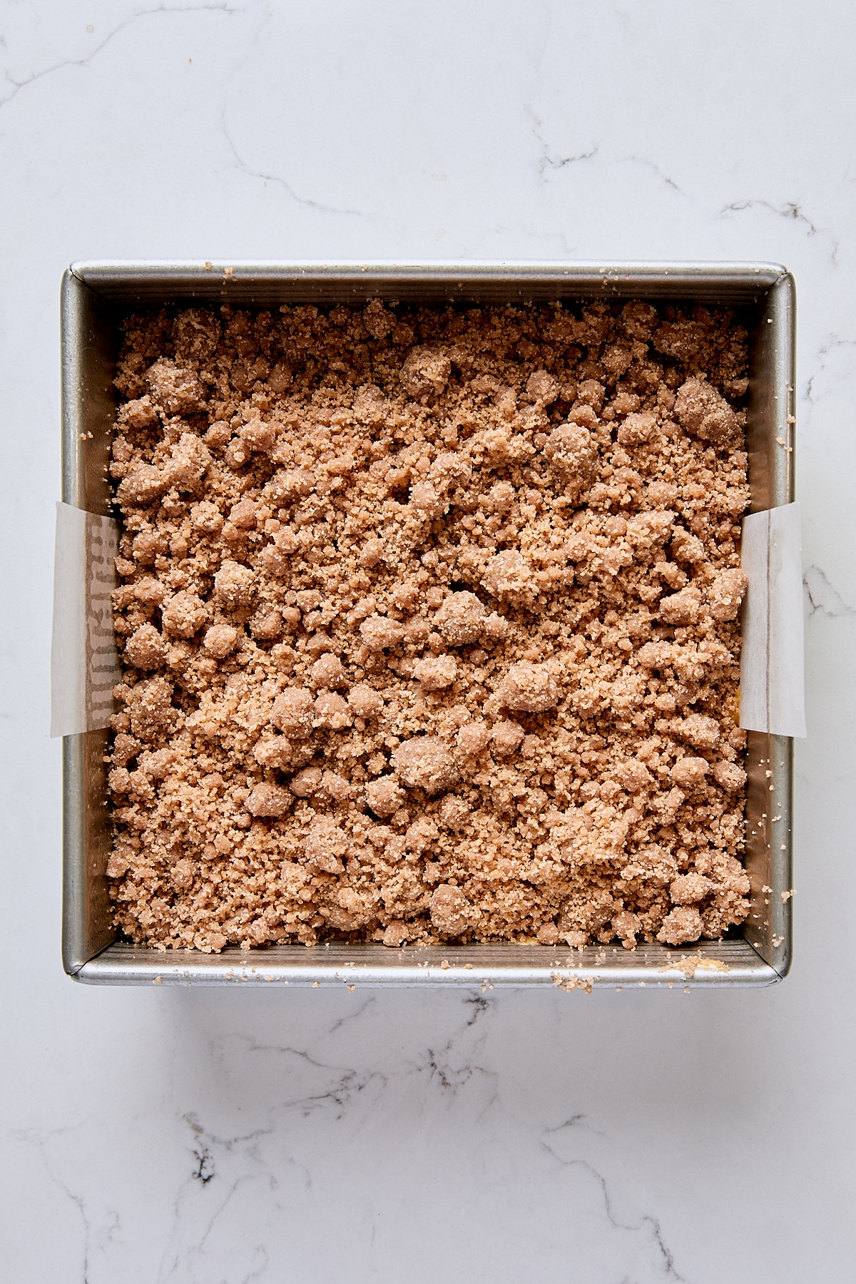 Assembled crumb cake in pan