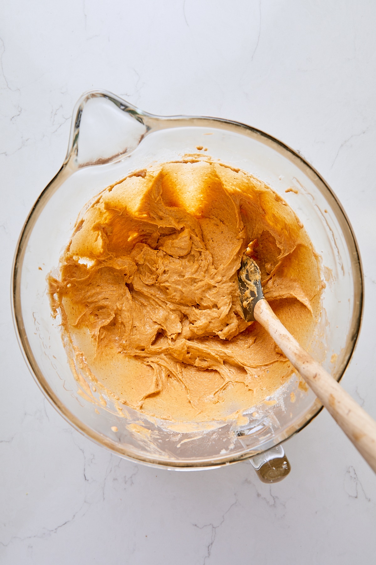 Pumpkin crumb cake batter in glass mixer bowl